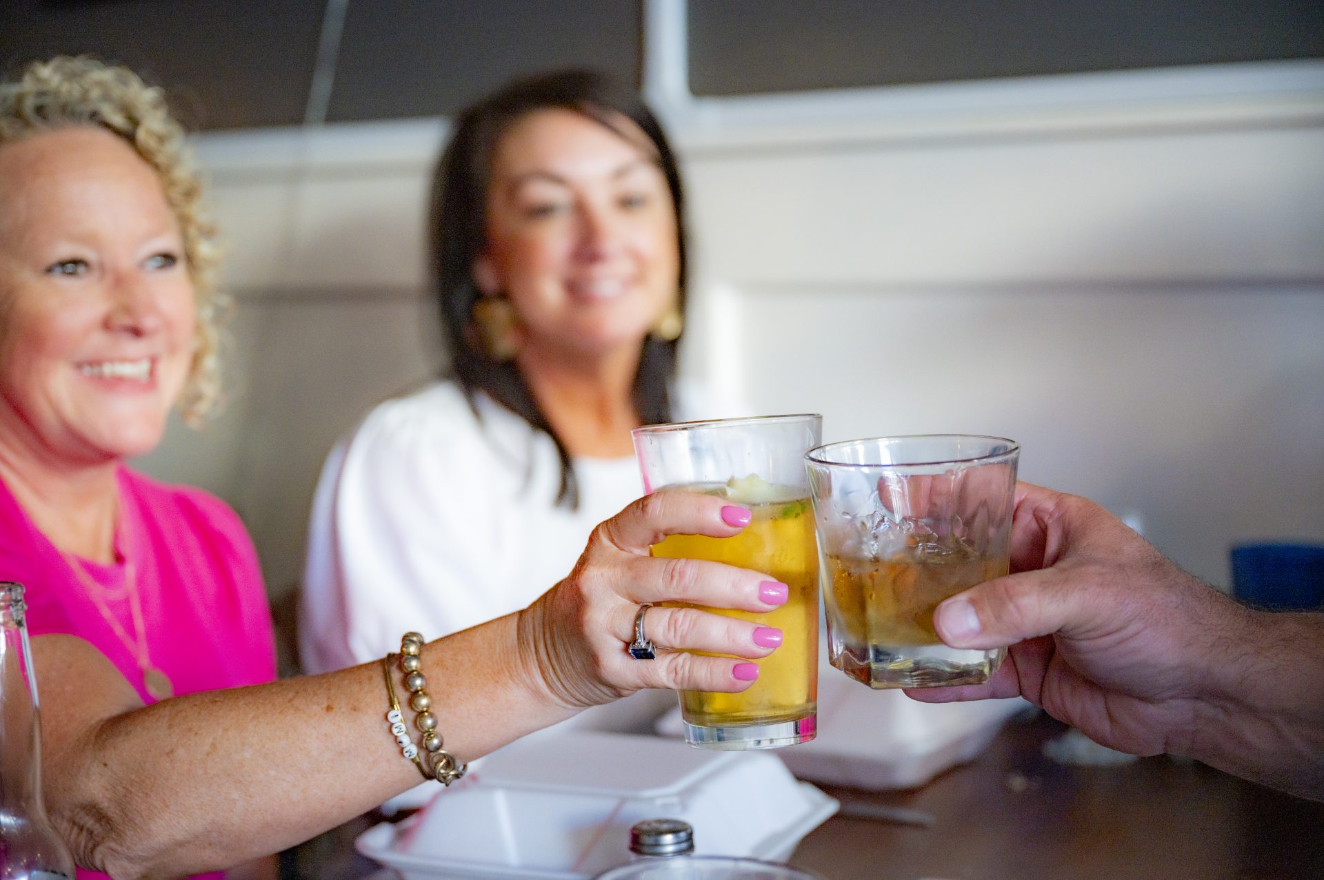 La Trattoria guests raising drinks in a toast